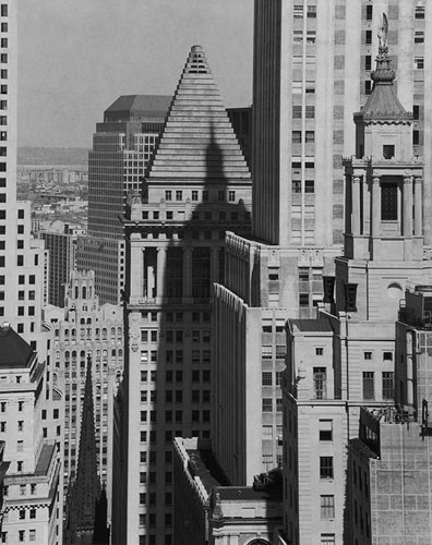 Wall Street, looking west, 1987.Near center: 16 Wall Street, Banker's Trust Company Building, 1912. Architect: Trowbridge & Livingston.Right: Eagle (top), 48 Wall Street, Bank of New York, 1929. Architect: Benjamin Wistar Morris.