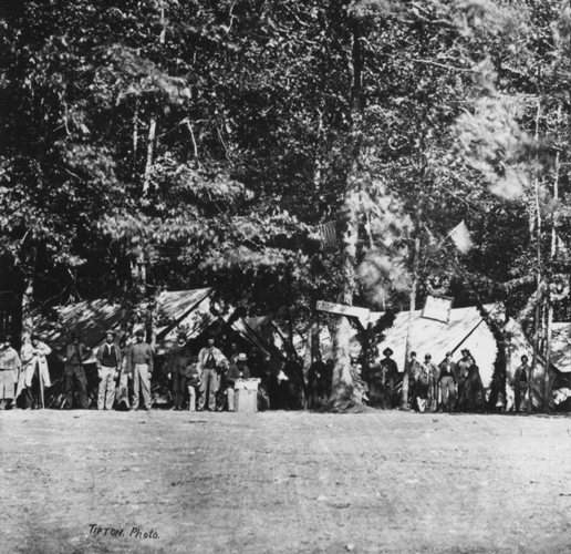 Field hospitals sprang up early in the days of fighting and remained long after the battle had ended. Often they were placed in converted structures, ranging from barns to the main classroom building at Pennsylvania (now Gettysburg) College. They were placed where they were needed; many, therefore, were located along the battlefield in the cover of forest outcroppings. Following the battle, when the landscape of battle became one of convalescence, the varied hospitals were condensed into one: Camp Lettermen. This July 1863 image by Charles and Isaac Tyson was taken from a Tipton stereo view. Source: Gettysburg National Military Park Archives.