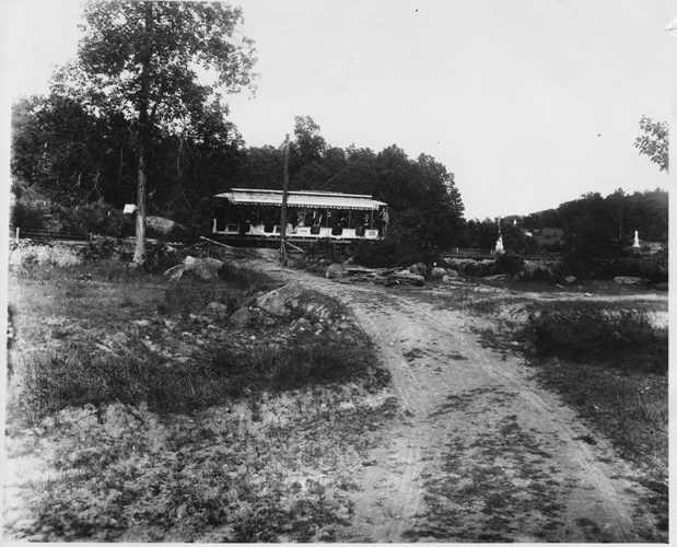 In this image (ca. 1890), the electric trolley arrives from the town of Gettysburg to the Devil’s Den area. Little Round Top (not pictured) is to the right of the white monuments (far right). Photographer unknown. Source: Gettysburg National Military Park Archives.