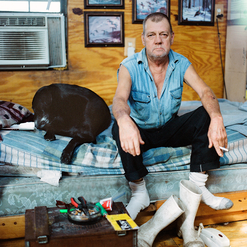 Retired fisherman and firefighter Al Blapport and his dog, Blue, in Shell Beach, 2012.