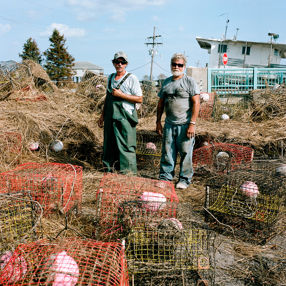 Crabbers Preacher (right) and his son recover after Hurricane Isaac in Hopedale, 2012.