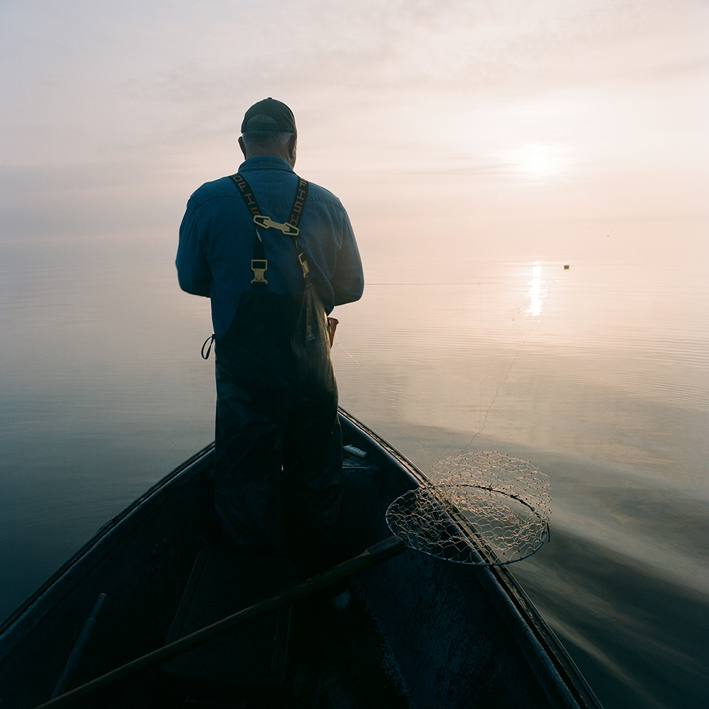 Rocky Rakocy pulling catfish lines in Lake Pontchartrain, 2013.