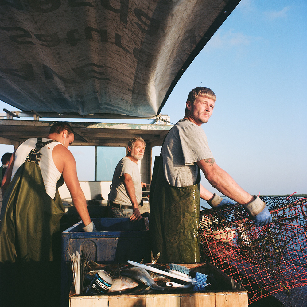 Preacher (center) and his deckhands pulling crab traps near Shell Beach, 2013.