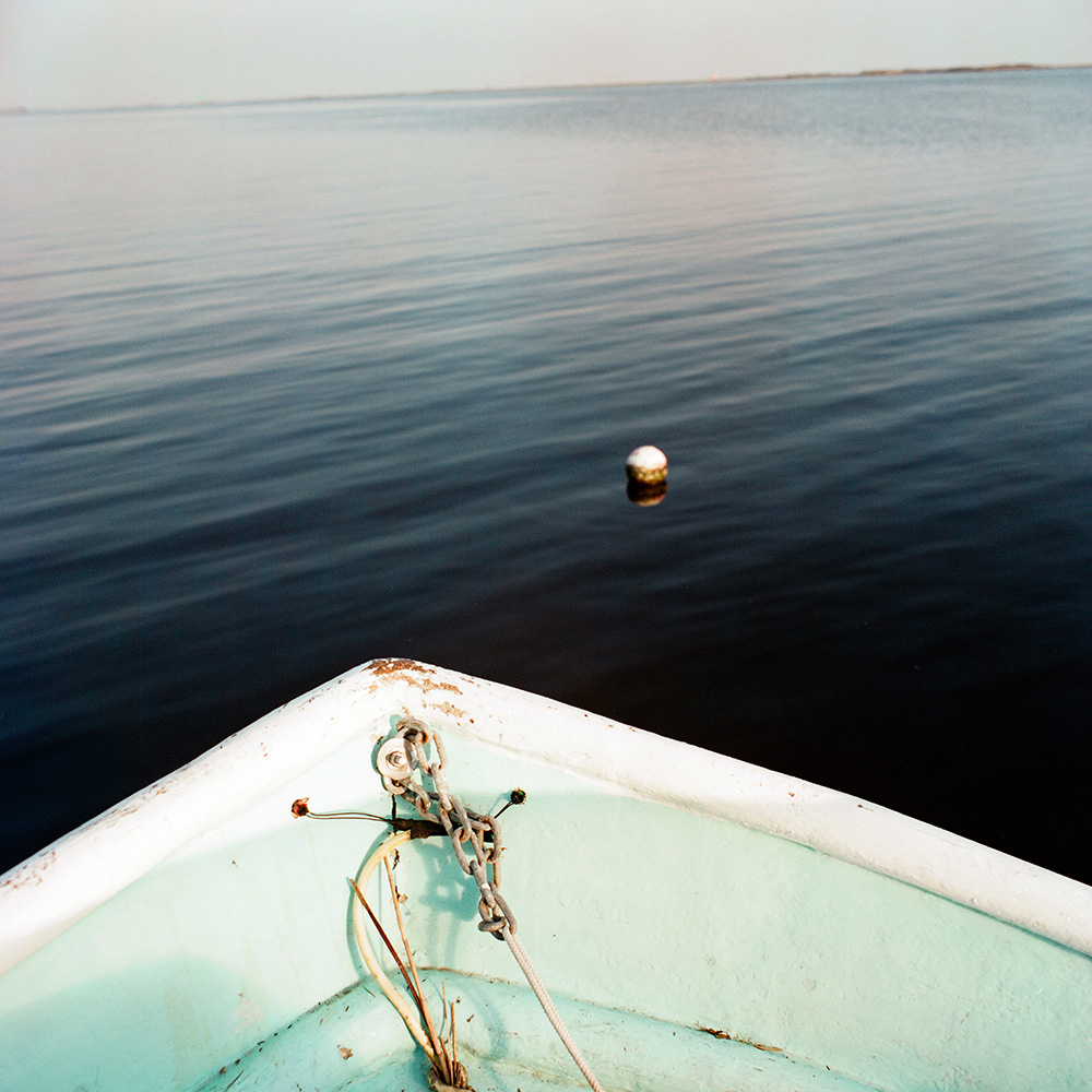 Preacher's boat approaches a crab trap buoy near Shell Beach, 2012.
