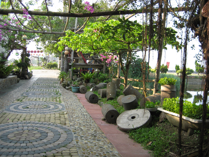 Ecological and cultural tourism have brought new life to abandoned villages in Japan, creating multi-generational family businesses like this bed-and-breakfast with gardens made from recycled beach detritus.