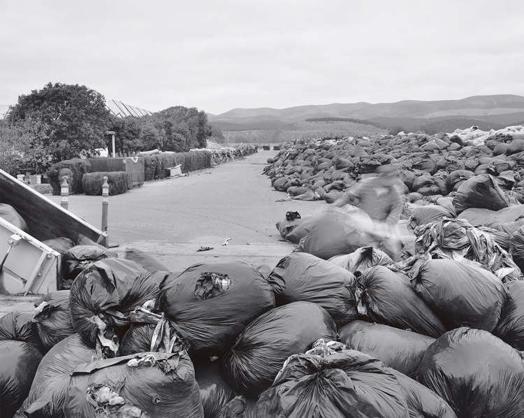 Unloading waste at the landfill.