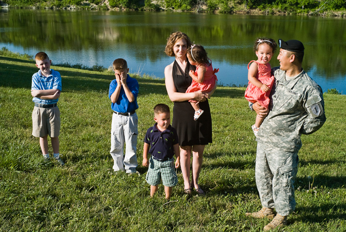  Jonathon Coughlin, of Manhattan, Kansas, with his family.  (© Lewis Kostiner)