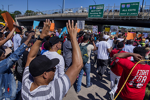 “Hands up, don’t shoot!” gesture at the “March against Gun Violence” protest on the Dan Ryan Expressway, Chicago, IL (2018).