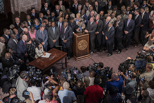 Governor Nikki Haley signing the bill to remove the Confederate battle flag from the State Capitol grounds, Columbia, SC (2015).