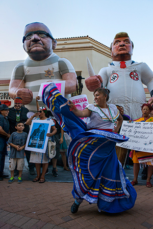 At the rally for immigration rights across the street from a pro-Trump rally being held <br>in the Convention Center, Phoenix, AZ (2016).