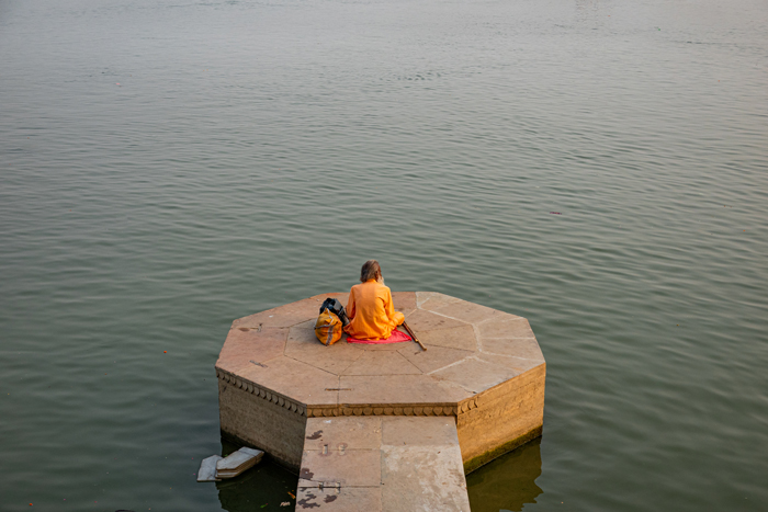 Possibly a Vaisnavite sadhu (a holy man dedicated to a spiritual order devoted to Vishnu) contemplating Ganga.