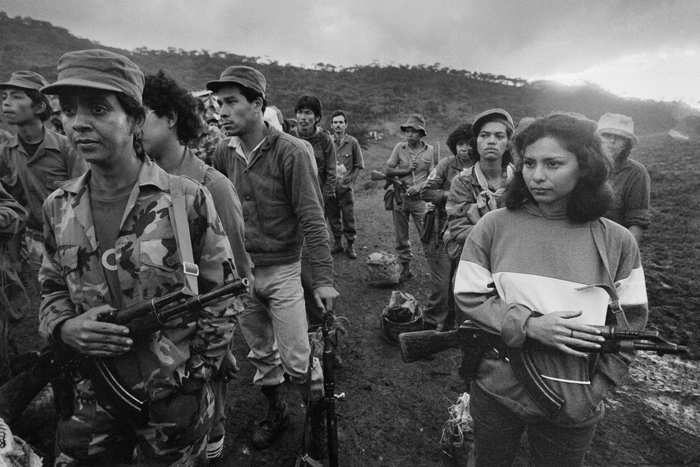 Volunteer &lt;i&gt;brigadistas&lt;/i&gt; receive a security briefing before they head out to harvest coffee at a state-run farm, Finca La Sorpresa, Jinotega Department, Nicaragua, February 1986.