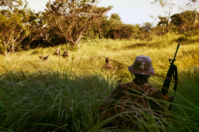 Salvadoran Army soldiers on an anti-guerrilla sweep, San Pedro Hills, El Salvador, July 1983.