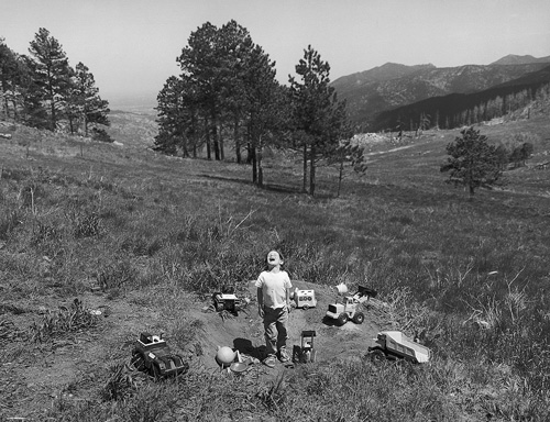 Justin with his construction toy-trucks, 2001